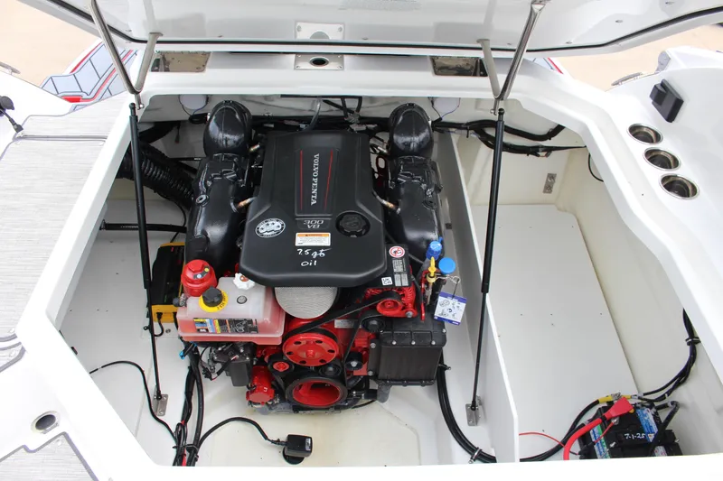 Slide: The Image of Engine compartment of a 2025 Cobalt R6 boat featuring a Volvo Penta engine. - 24