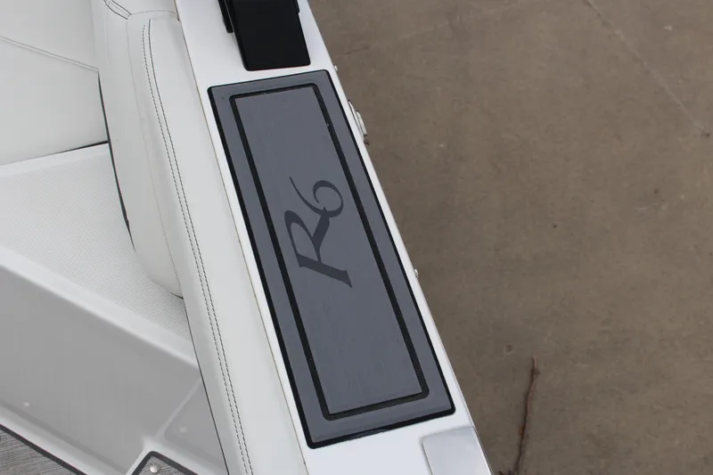 Slide: The Image of 2025 Cobalt R6 boat interior with sleek white seating and R6 logo detail. - 31