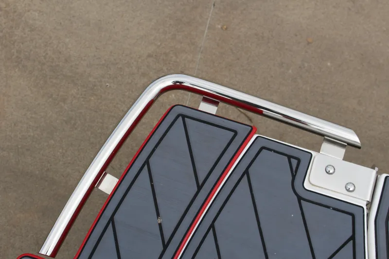Slide: The Image of 2025 Cobalt R6 boat deck with sleek chrome railing and geometric design. - 33