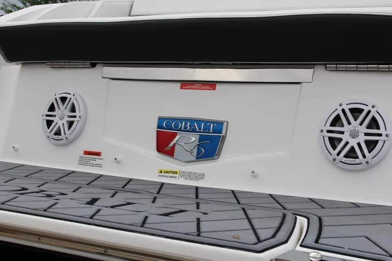 Slide: The Image of 2025 Cobalt R6 boat rear view with speakers and logo. - 7