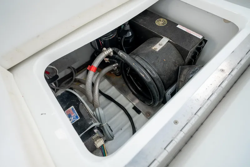 Slide: The Image of 2008 Formula 40 Performance Cruiser engine compartment with visible components and wiring. - 23