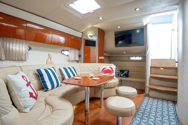 Slide: The Image of Luxurious interior of 2008 Formula 40 Performance Cruiser with plush seating and nautical decor. - 26