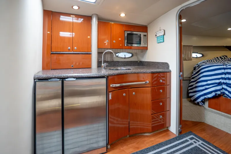 Slide: The Image of 2008 Formula 40 Performance Cruiser interior with kitchenette and cozy bedroom. - 27