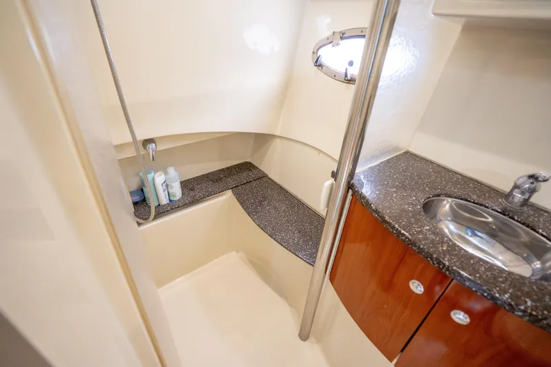 Slide: The Image of 2008 Formula 40 Performance Cruiser bathroom with shower, sink, and porthole window. - 33