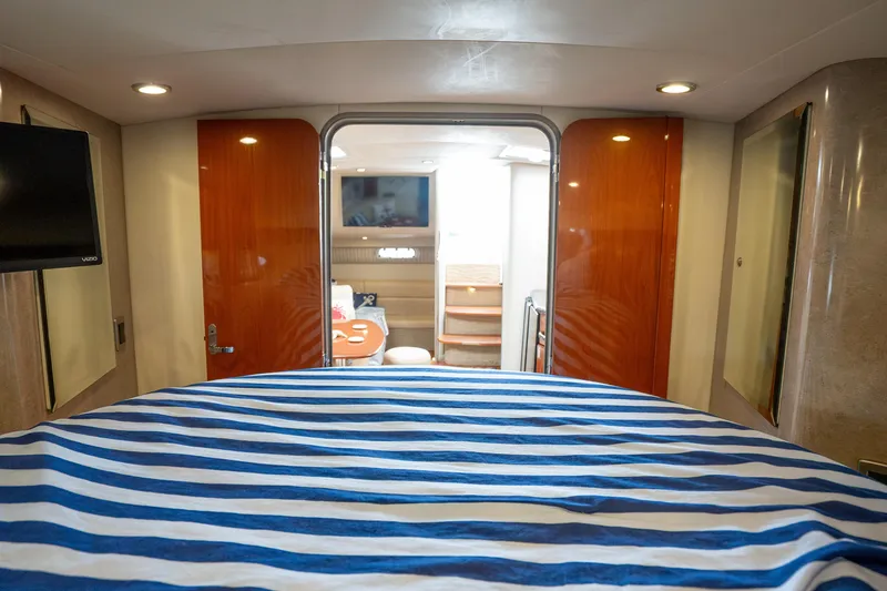 Slide: The Image of Interior of 2008 Formula 40 Performance Cruiser with striped bedding and wooden accents. - 36