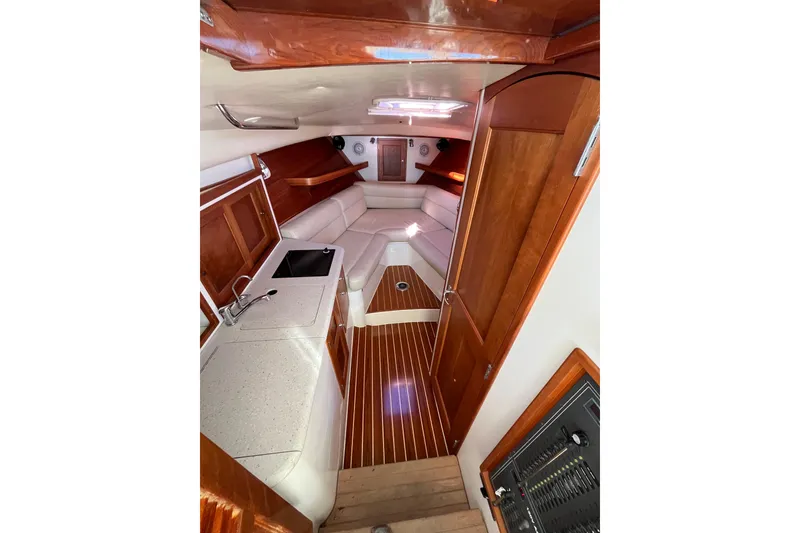 Slide: The Image of Luxurious interior of 2009 MJM 29z Express boat with wood finishes and seating area. - 15