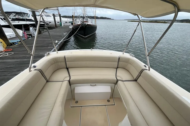 Slide: The Image of 2009 MJM 29z Express boat with beige seating, docked by the water. - 5