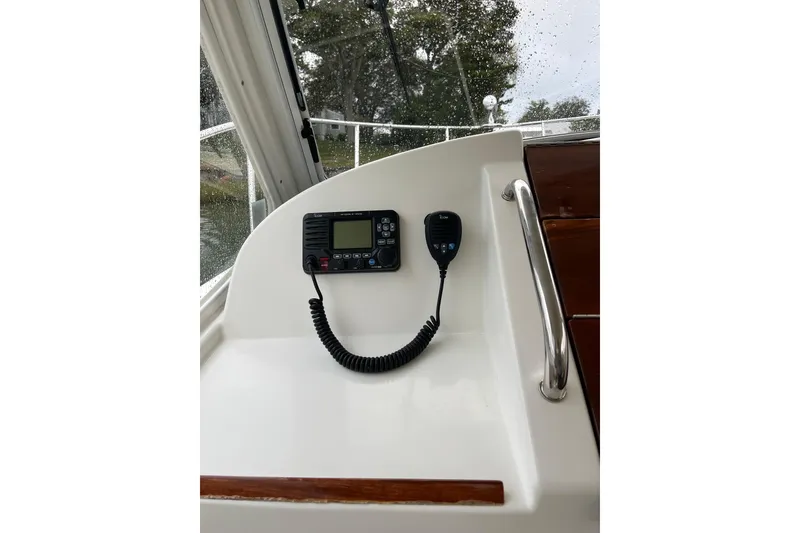 Slide: The Image of 2009 MJM 29z Express boat interior with radio and microphone setup. - 8