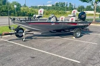 Slide: The Image of 2017 Tracker Pro Team 175 TF boat parked in a lot, side view. - 11