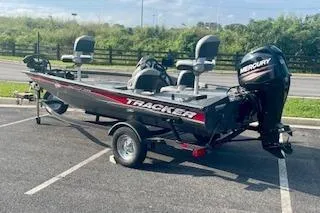 Slide: The Image of 2017 Tracker Pro Team 175 TF boat with Mercury engine in parking lot. - 13