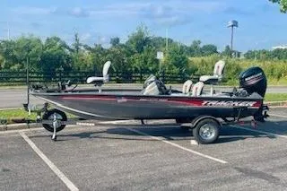 Slide: The Image of 2017 Tracker Pro Team 175 TF boat parked in a lot, side view. - 8