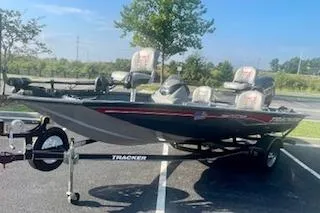 Slide: The Image of 2017 Tracker Pro Team 175 TF boat on trailer in parking lot. - 9