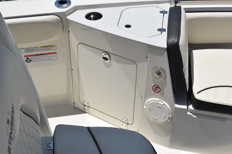 Slide: The Image of 2021 Stingray 236CC boat interior with seating and storage compartment. - 11