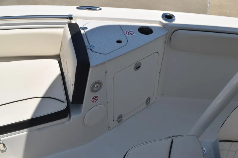 Slide: The Image of 2021 Stingray 236CC boat interior with seating and storage compartment. - 13