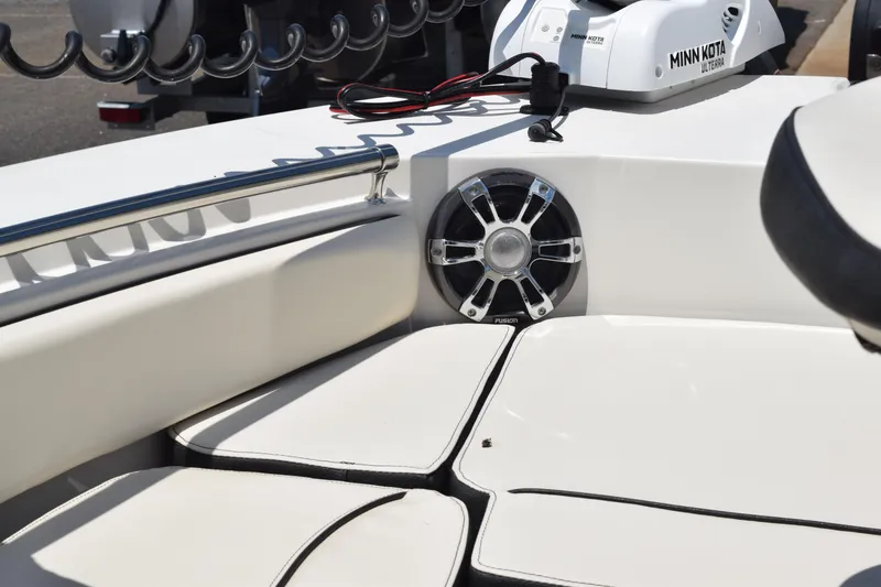 Slide: The Image of 2021 Stingray 236CC boat interior with speaker and Minn Kota trolling motor. - 20