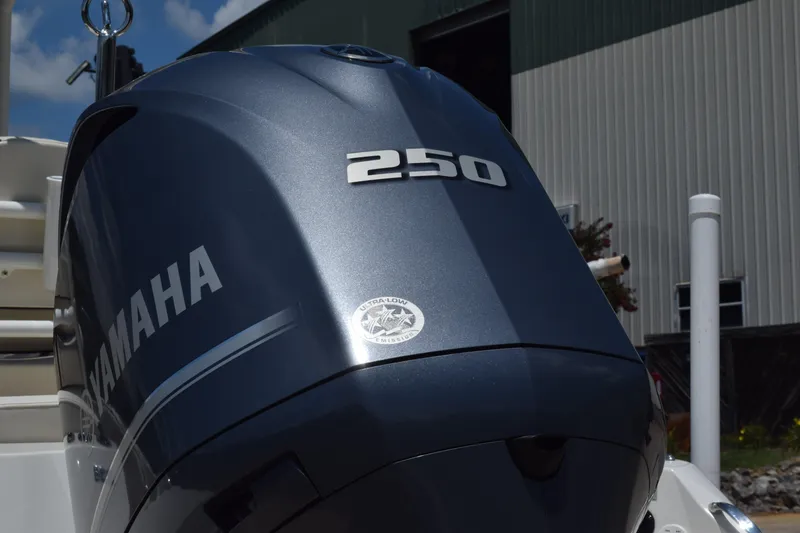 Slide: The Image of Yamaha 250 outboard motor on 2021 Stingray 236CC boat, docked near a building. - 3