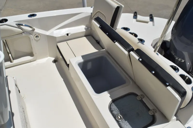Slide: The Image of 2021 Stingray 236CC boat interior with seating and storage compartments. - 31
