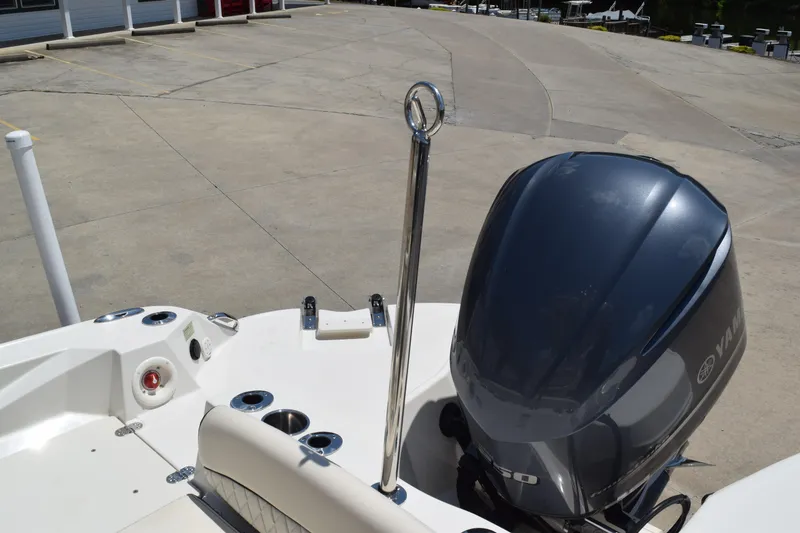 Slide: The Image of 2021 Stingray 236CC boat with Yamaha outboard motor in a parking area. - 33