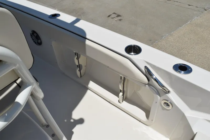 Slide: The Image of 2021 Stingray 236CC boat interior with cup holders and seating detail. - 34