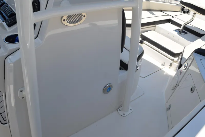 Slide: The Image of 2021 Stingray 236CC boat interior with seating and control panel. - 35