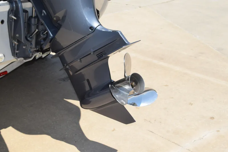 Slide: The Image of 2021 Stingray 236CC boat motor with shiny propeller on concrete surface. - 4