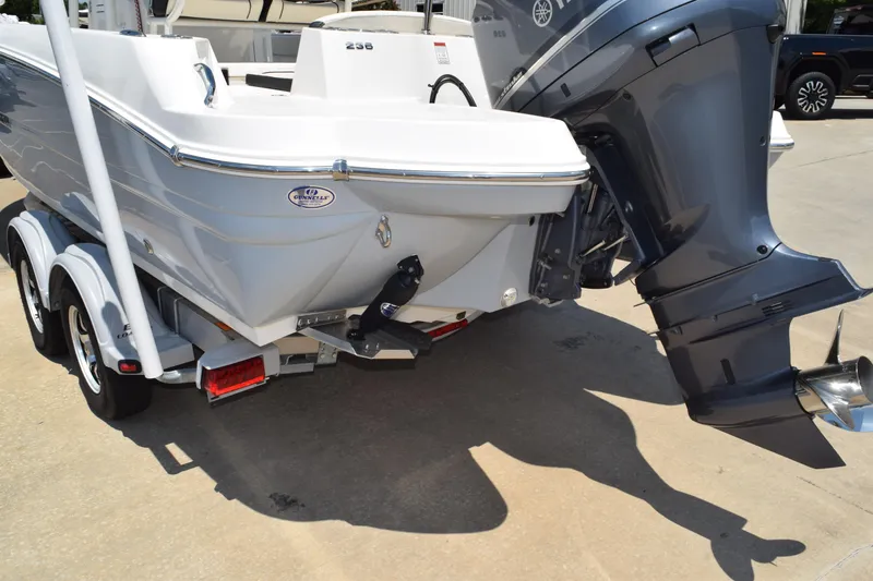 Slide: The Image of 2021 Stingray 236CC boat on trailer with powerful outboard motor. - 6