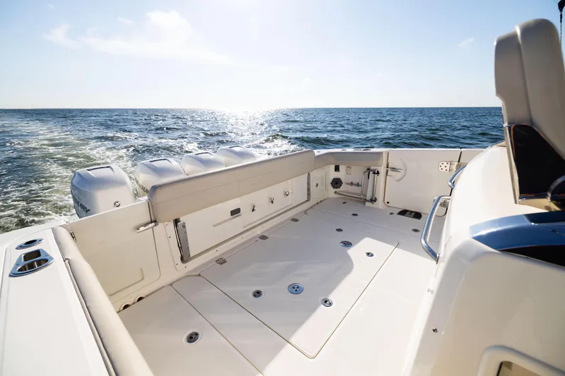 Slide: The Image of 2021 Boston Whaler 420 Outrage boat deck with ocean view and powerful engines. - 26