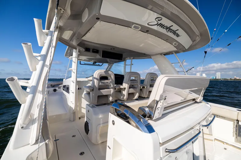 Slide: The Image of 2021 Boston Whaler 420 Outrage boat interior with seating and ocean view. - 37