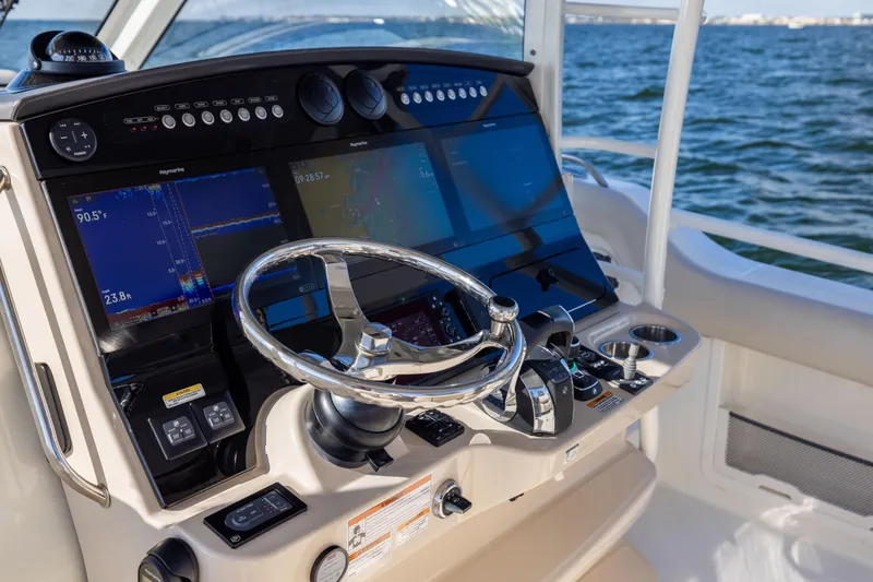 Slide: The Image of 2021 Boston Whaler 420 Outrage helm with advanced navigation displays and controls. - 47