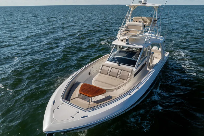Slide: The Image of 2021 Boston Whaler 420 Outrage cruising on open water, showcasing luxury and performance. - 5