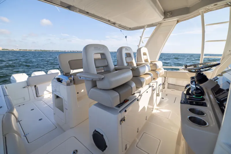 Slide: The Image of 2021 Boston Whaler 420 Outrage boat interior with luxurious seating and ocean view. - 51