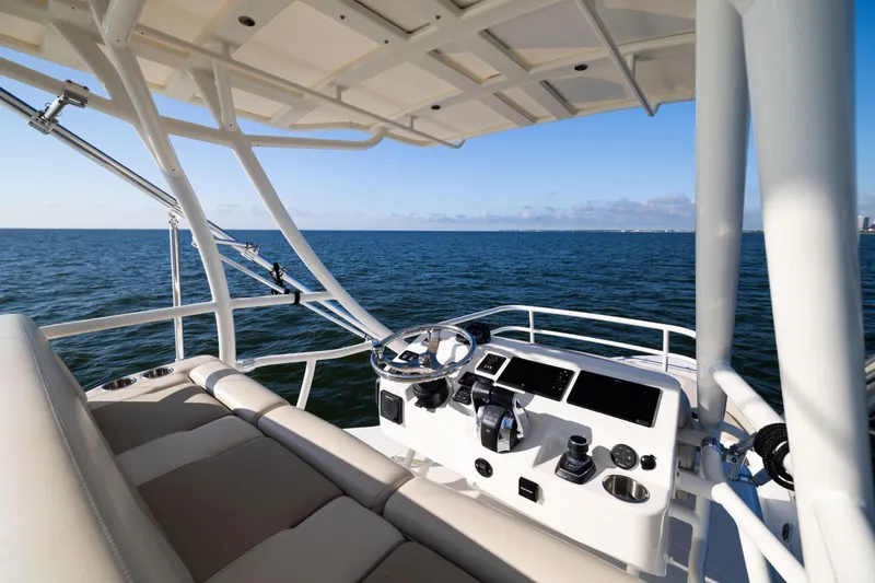 Slide: The Image of 2021 Boston Whaler 420 Outrage helm with ocean view, showcasing luxury and advanced navigation features. - 60