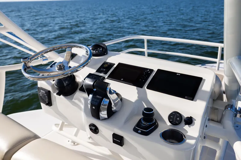 Slide: The Image of Control panel of 2021 Boston Whaler 420 Outrage boat with ocean view. - 61