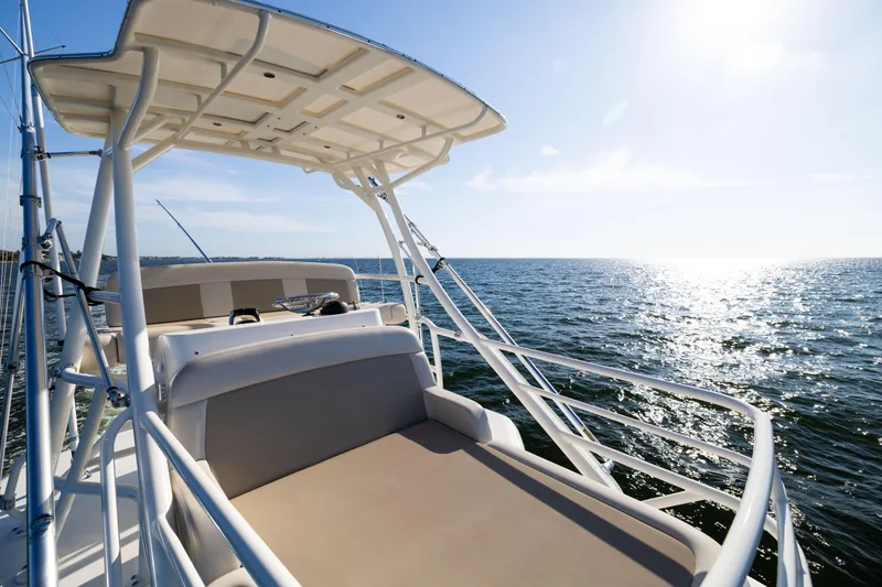 Slide: The Image of 2021 Boston Whaler 420 Outrage boat on open sea under clear sky. - 64