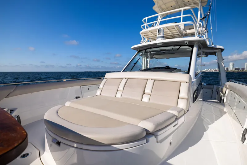 Slide: The Image of 2021 Boston Whaler 420 Outrage boat with luxurious seating, cruising on open water. - 68