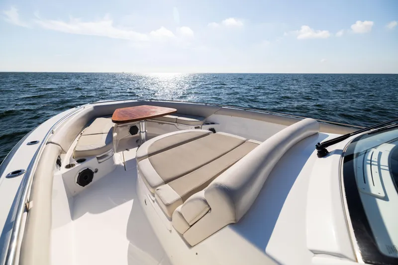 Slide: The Image of 2021 Boston Whaler 420 Outrage boat interior with seating and table, ocean view. - 69