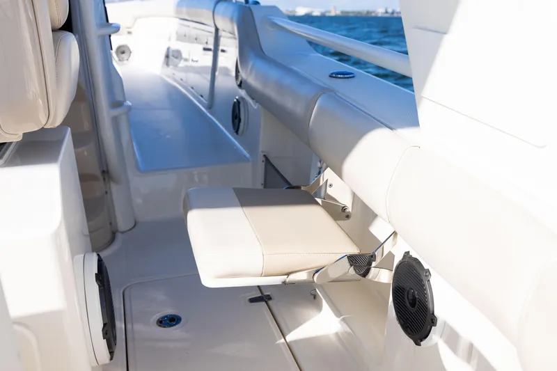 Slide: The Image of 2021 Boston Whaler 420 Outrage interior with seating and speaker detail. - 74