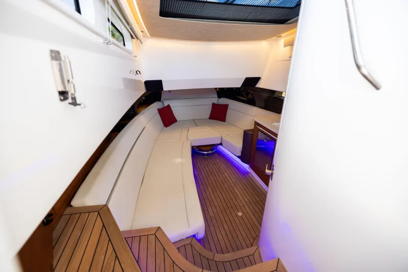 Slide: The Image of Luxurious interior of 2021 Boston Whaler 420 Outrage with elegant seating and ambient lighting. - 75
