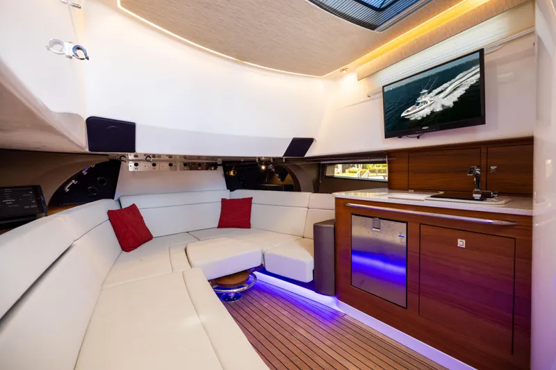 Slide: The Image of Luxurious interior of 2021 Boston Whaler 420 Outrage with modern seating and kitchenette. - 76