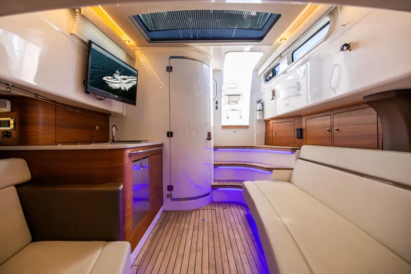 Slide: The Image of Luxurious interior of 2021 Boston Whaler 420 Outrage with modern amenities and elegant design. - 78