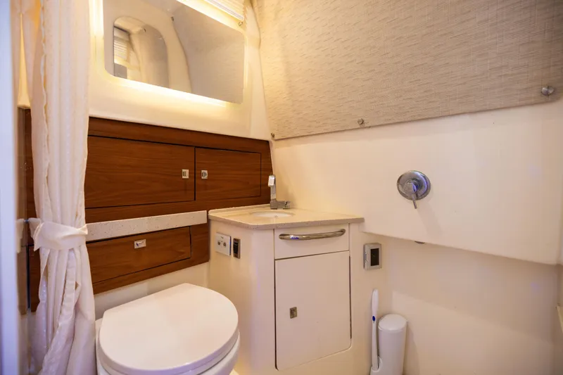 Slide: The Image of Luxurious bathroom interior of 2021 Boston Whaler 420 Outrage boat, featuring modern amenities. - 80