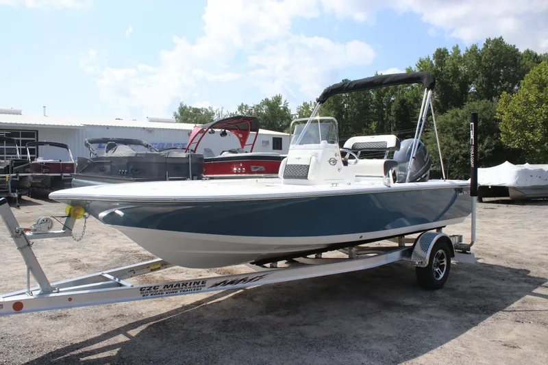 The Image of 2026 Tidewater 1910 Bay Max boat on trailer, parked outdoors under a clear sky. - 0