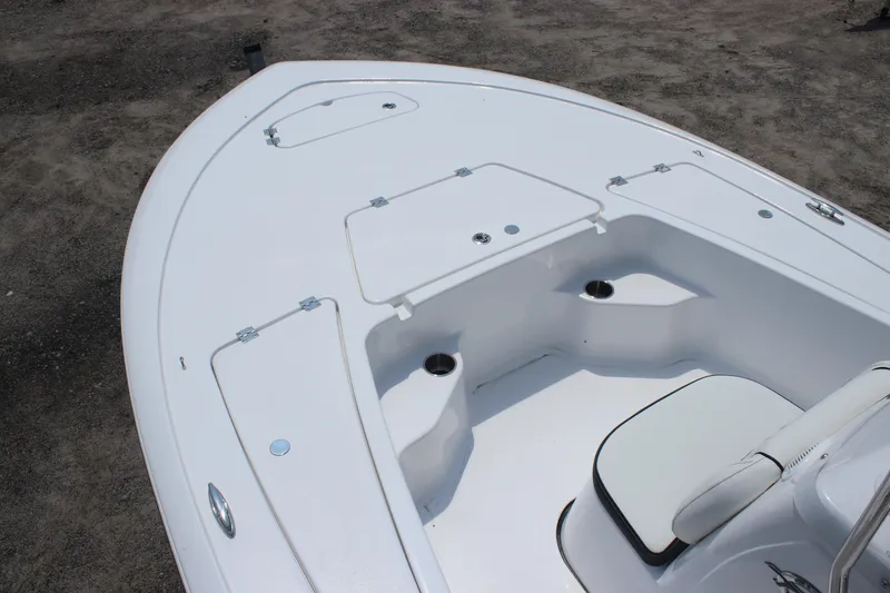 Slide: The Image of 2026 Tidewater 1910 Bay Max boat deck with storage compartments and seating. - 10