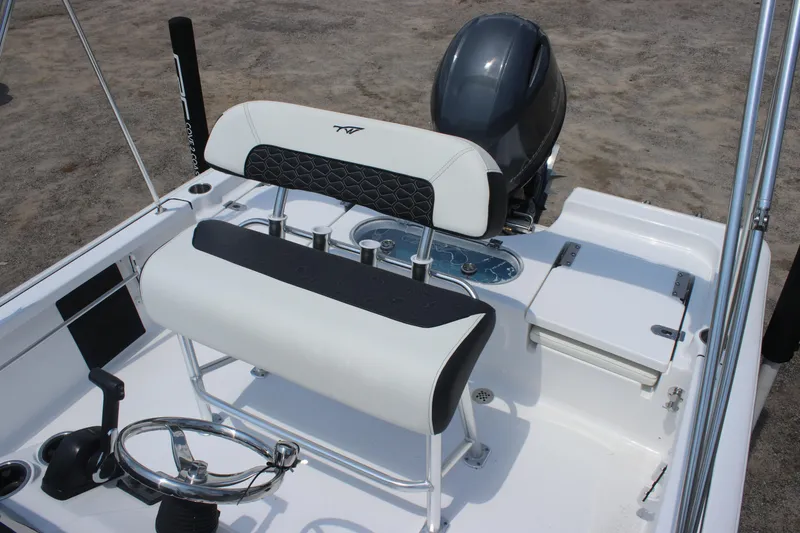 Slide: The Image of 2026 Tidewater 1910 Bay Max boat interior with seating and steering wheel. - 11