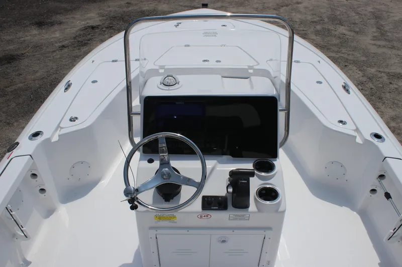 Slide: The Image of Tidewater 1910 Bay Max 2026 boat console with steering wheel and controls. - 12