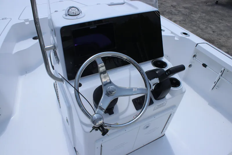 Slide: The Image of 2026 Tidewater 1910 Bay Max boat console with steering wheel and controls. - 13
