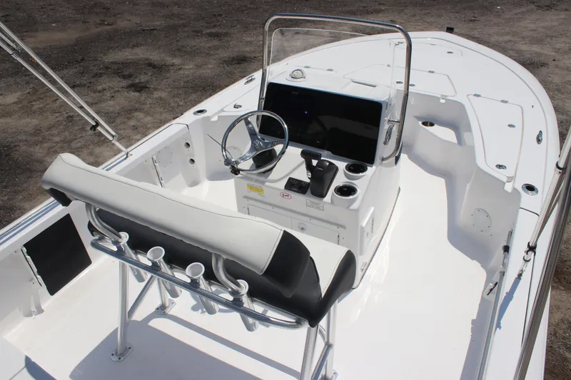 Slide: The Image of 2026 Tidewater 1910 Bay Max boat interior with steering console and seating. - 22