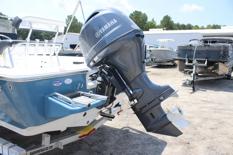 Slide: The Image of 2026 Tidewater 1910 Bay Max boat with Yamaha outboard motor in a marina setting. - 3