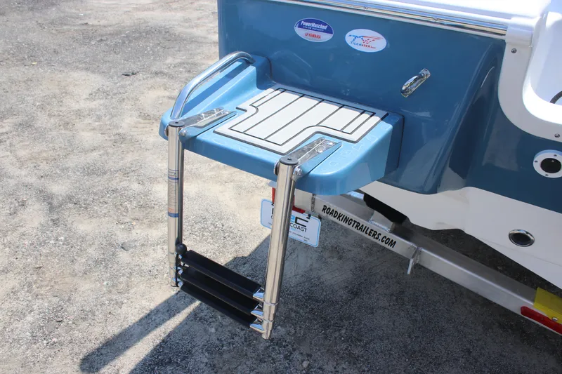 Slide: The Image of 2026 Tidewater 1910 Bay Max boat with a foldable swim ladder and blue hull. - 4