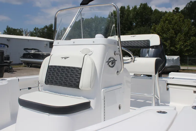 Slide: The Image of 2026 Tidewater 1910 Bay Max boat interior with sleek white and black seating. - 5